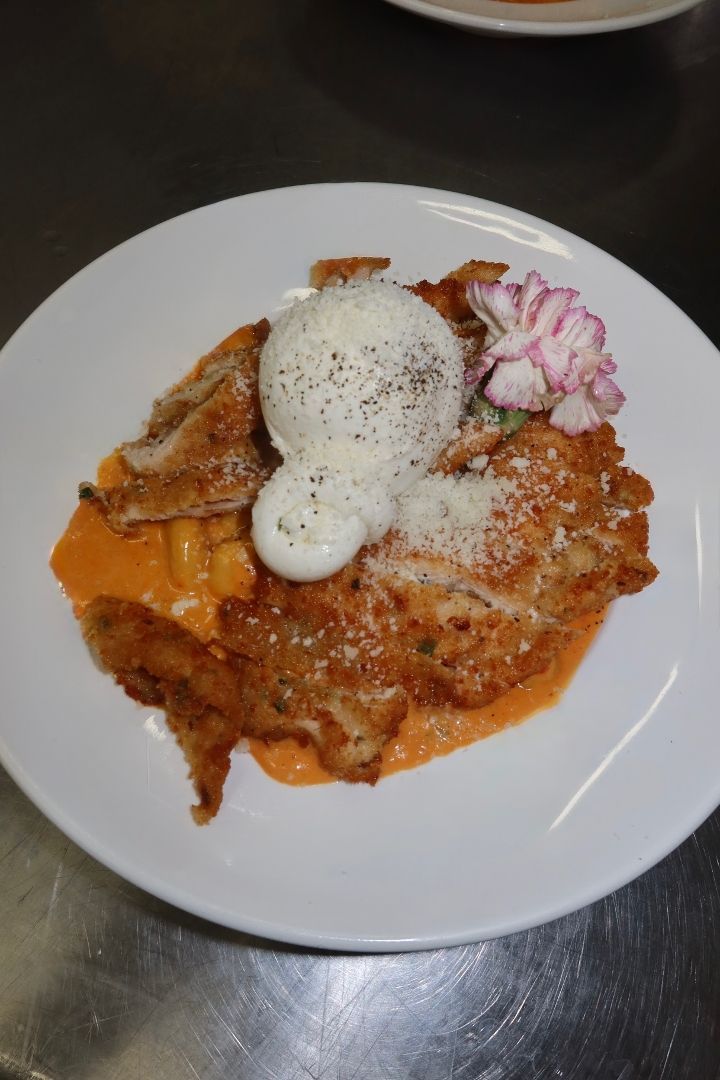Vodka Gnocchi topped with chicken cutlet and creamy burrata cheese